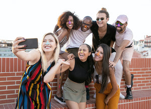 Group of friends wearing colorful sunscreen